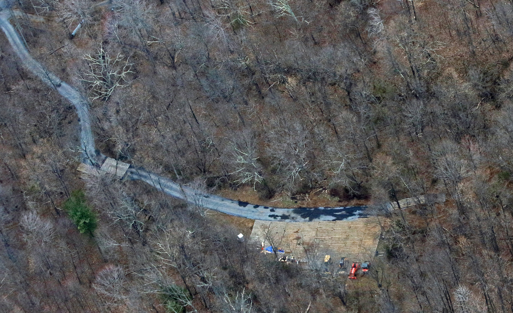 Apparent equipment staging area and new or reconstructed road and bridges observed during Pipeline Air Force surveillance flights.